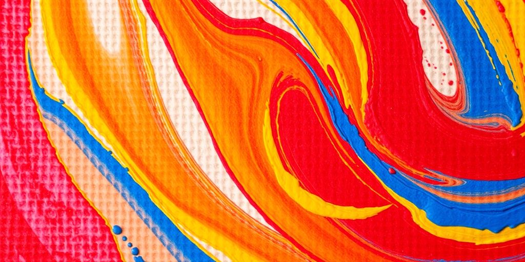 Vibrant primary colors swirling on canvas.