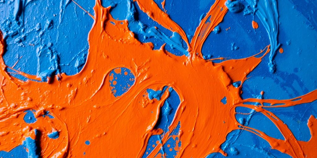 Vibrant paint strokes swirling with deep blues and fiery oranges.